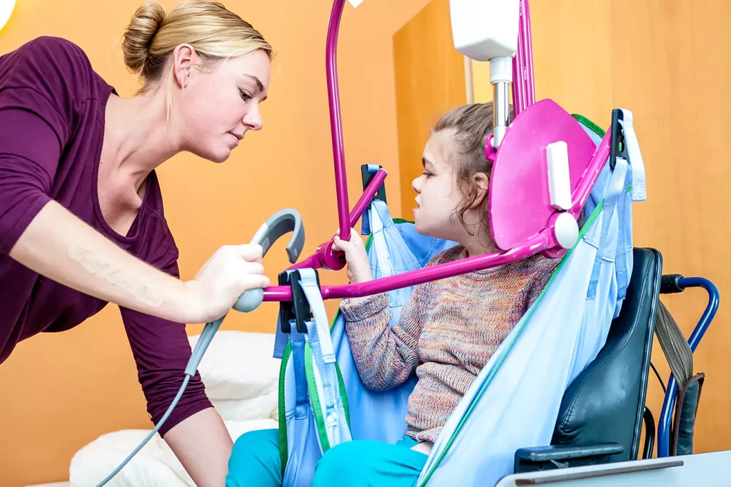 A disabled girl and her support worker